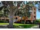 Multi-story condo building showcasing architectural details, manicured landscaping and a grand entrance at 5000 Culbreath Key Way # 9-101, Tampa, FL 33611