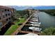 Scenic canal view with docked boats and lush landscaping, showcasing waterfront living at its finest at 5000 Culbreath Key Way # 9-101, Tampa, FL 33611