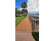 Scenic wooden walkway leading to boat docks, nestled amidst lush greenery and tranquil waterways at 5000 Culbreath Key Way # 9-101, Tampa, FL 33611