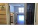 View from entryway showing living room, hard wood floors, and large window at 5000 Culbreath Key Way # 9-101, Tampa, FL 33611