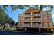 Three-story condominium building with balconies and covered parking at 5000 Culbreath Key Way # 9-101, Tampa, FL 33611