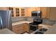 View of the kitchen featuring stainless steel appliances and wood cabinets at 5000 Culbreath Key Way # 9-101, Tampa, FL 33611