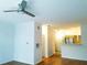 Living room shows hardwood floors, fan, and entry to kitchen at 5000 Culbreath Key Way # 9-101, Tampa, FL 33611