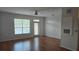 Spacious living room with wood floors, fan, and natural light at 5000 Culbreath Key Way # 9-101, Tampa, FL 33611