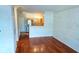 Open living space with wood floors and access to the kitchen at 5000 Culbreath Key Way # 9-101, Tampa, FL 33611