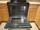 Electric oven with stainless steel racks and convection features is surrounded by light wood cabinets at 5000 Culbreath Key Way # 9-101, Tampa, FL 33611