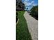 Picturesque path leading through manicured grounds, creating a peaceful and inviting outdoor space at 5000 Culbreath Key Way # 9-101, Tampa, FL 33611