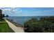 Scenic waterfront with walking path and mature trees overlooking calm waters, perfect for relaxing strolls at 5000 Culbreath Key Way # 9-101, Tampa, FL 33611