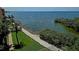 Expansive waterfront view with walking path and bay access, offering serene coastal living at 5000 Culbreath Key Way # 9-101, Tampa, FL 33611