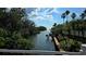 Scenic waterway surrounded by lush greenery and swaying palm trees at 5000 Culbreath Key Way # 9-101, Tampa, FL 33611