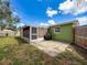 Backyard patio with space for a BBQ and outdoor dining, perfect for entertaining at 5415 Riddle Rd, Holiday, FL 34690