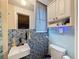Small bathroom featuring blue mosaic tiles at 5415 Riddle Rd, Holiday, FL 34690