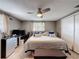 Comfortable bedroom with a ceiling fan, a window, a double bed and a closet at 5415 Riddle Rd, Holiday, FL 34690
