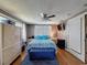 Bedroom with a bed, a ceiling fan, and a window at 5415 Riddle Rd, Holiday, FL 34690