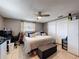Comfortable bedroom with a ceiling fan, a window, a double bed and a closet at 5415 Riddle Rd, Holiday, FL 34690