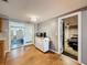 An open dining area features a cart with storage and a microwave, connecting to the bedroom at 5415 Riddle Rd, Holiday, FL 34690