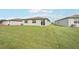 Expansive backyard with lush lawn, ideal for outdoor activities and relaxation at 7728 Gilchrist Springs Dr, Parrish, FL 34219