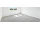 A clean and bright bedroom with a large window showcasing the view at 7728 Gilchrist Springs Dr, Parrish, FL 34219