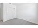 Bedroom offers a closet with sliding doors, carpet, and neutral walls at 7728 Gilchrist Springs Dr, Parrish, FL 34219