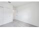 Bedroom features sliding closet doors, carpet, and neutral paint at 7728 Gilchrist Springs Dr, Parrish, FL 34219