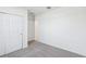 A view of the bedroom with an open closet door and carpet at 7728 Gilchrist Springs Dr, Parrish, FL 34219