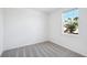 A brightly lit bedroom with a window overlooking the outdoors at 7728 Gilchrist Springs Dr, Parrish, FL 34219