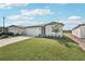 Charming single-story home with a well-manicured lawn and attached two-car garage at 7728 Gilchrist Springs Dr, Parrish, FL 34219
