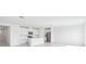 Bright, open kitchen featuring an island, stainless steel appliances, and white cabinetry at 7728 Gilchrist Springs Dr, Parrish, FL 34219