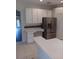 Bright, open kitchen with white cabinets and stainless steel appliances at 10415 Lucaya Dr, Tampa, FL 33647