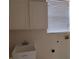 The laundry room features overhead cabinets and a utility sink at 10415 Lucaya Dr, Tampa, FL 33647