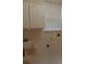 The laundry room features overhead cabinets and a utility sink at 10415 Lucaya Dr, Tampa, FL 33647