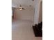 Bright living room with a ceiling fan, and white tile flooring at 10415 Lucaya Dr, Tampa, FL 33647