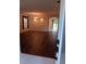 Bright living room featuring wood floors, neutral paint, and an archway to another room at 10415 Lucaya Dr, Tampa, FL 33647