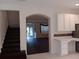 View of entry door, living room and stairs showing open concept design at 10415 Lucaya Dr, Tampa, FL 33647