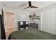 Another view of the cozy bedroom with ceiling fan, decor, and carpet offers a comfortable personal space at 13083 Burns Dr, Odessa, FL 33556