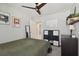 Cozy bedroom with ceiling fan, decor, and carpet offers a comfortable personal space at 13083 Burns Dr, Odessa, FL 33556