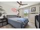 Stylized bedroom featuring unique wall art, modern decor, and a comfortable bed at 13083 Burns Dr, Odessa, FL 33556