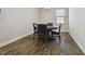 A simple, elegant dining area features a wooden table with seating for four at 13083 Burns Dr, Odessa, FL 33556