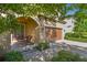 Inviting home exterior with a covered entryway and a charming bench seating area at 13083 Burns Dr, Odessa, FL 33556