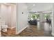 Open floor plan view of living room with ceiling fan and an open view of backyard at 13083 Burns Dr, Odessa, FL 33556