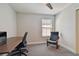 Another angle of the home office space with modern desk setup and comfortable chair at 13083 Burns Dr, Odessa, FL 33556