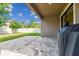 Outdoor patio featuring stone pavers, green grass, a privacy fence, and a covered cooking area at 13083 Burns Dr, Odessa, FL 33556