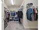 A walk-in closet with shelves and racks keeps all your clothes organized and easy to access at 13083 Burns Dr, Odessa, FL 33556