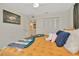 Bedroom featuring a tan patterned comforter, ceiling fan, and ensuite access at 709 S Himes Ave, Tampa, FL 33609