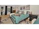 Comfortable bedroom features stylish decor, black-out curtains, an area rug, and a well-lit ambiance at 709 S Himes Ave, Tampa, FL 33609