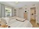 Cozy bedroom features a large window, closet space, and natural light at 709 S Himes Ave, Tampa, FL 33609