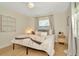 This bedroom offers a comfortable bed, a window, and a rustic aesthetic at 709 S Himes Ave, Tampa, FL 33609