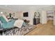 Spacious bedroom showcasing a bed, a TV, a dresser, and light hardwood flooring at 709 S Himes Ave, Tampa, FL 33609