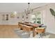 Elegant dining room with modern chandelier and table set for six at 709 S Himes Ave, Tampa, FL 33609