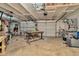 Spacious garage with overhead storage and a variety of tools and equipment at 709 S Himes Ave, Tampa, FL 33609
